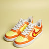 Hand-painted sneakers with design infired from fire on a lemon yellow background