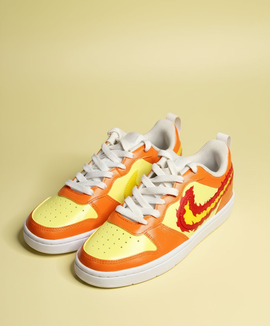 Hand-painted sneakers with design infired from fire on a lemon yellow background