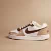 Hand-painted Brown and white sneaker with Nike logo on a beige background