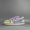 custom painted Nike Pair of sneakers with a multi color (yellow, green and purple) with comic book and cartoon design on a light grey background