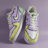 Hand-painted Nike sneakers with a multi color (yellow, green and purple) with outline like sketch design on a light purple background