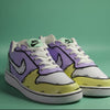 custom painted Pair of sneakers with a multi color (yellow, green and purple) with comic book design on a pistachio green background