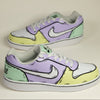 Hand-painted sneakers with a multi color (yellow, green and purple) with sketch outline 
design on a off-white background