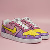 Hand-painted colourful (pink, purple and yellow) Nike sneakers with cartoonish lines and melted effect design on a light pink background