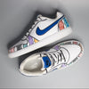Hand-painted sneakers with colorful patterns and motifs  and blue swoosh logo on a gray background