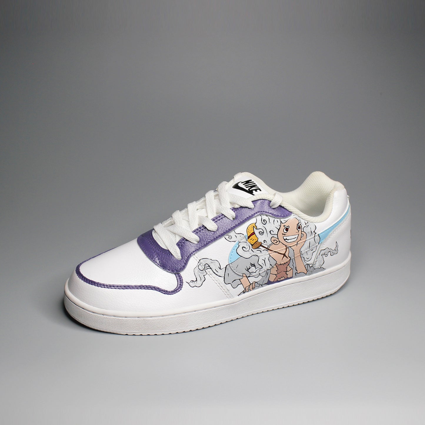 Hand-painted White Nike sneaker with One Piece inspired design on a light gray background