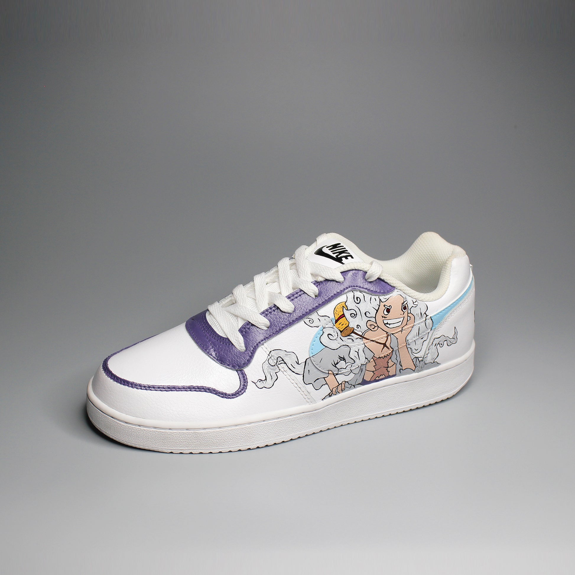 Hand-painted White Nike sneaker with One Piece inspired design on a light gray background