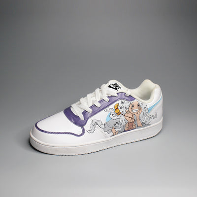 Hand-painted White Nike sneaker with One Piece inspired design on a light gray background
