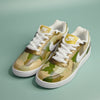 Hand-painted Camouflage sneakers with white laces and Nike logo on a pistachio green background