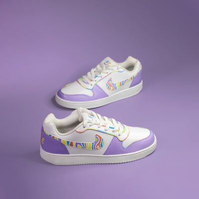 Pair of Nike white sneakers hand-painted in purple with colourful accents on a purple background